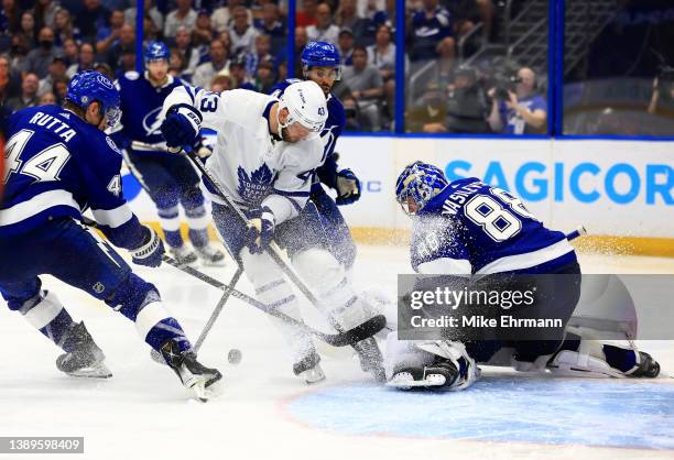 Andrei Vasilevskiy of the Tampa Bay Lightning stops a shot from Kyle Clifford of the Toronto Maple Leafs in the third period during a game at Amalie...