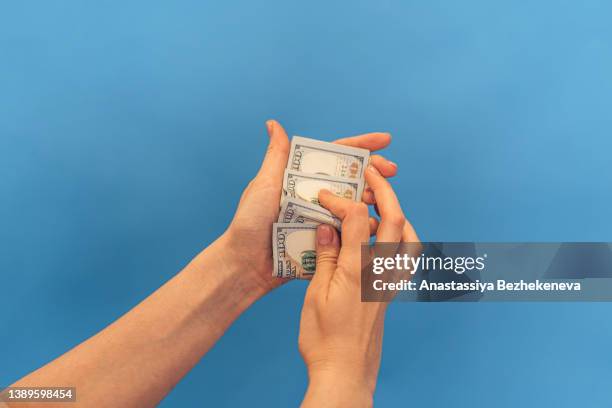 women's hands count one hundred dollar bills - beak ストックフォトと画像