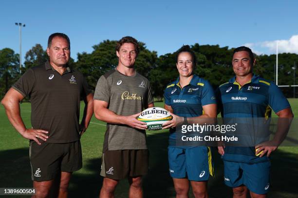 Wallabies coach Dave Rennie and captain Michael Hooper pose with Wallaroos assistant coach Sione Fukofuka and player Shannon Parry during the Rugby...