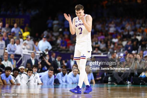 Christian Braun of the Kansas Jayhawks reacts against the North Carolina Tar Heels during the second half of the 2022 NCAA Men's Basketball...