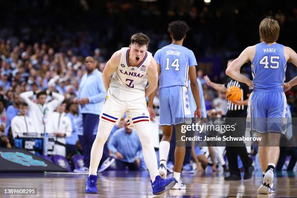 Christian Braun of the Kansas Jayhawks reacts to a play against the North Carolina Tar Heels during the second half of the 2022 NCAA Men's Basketball...