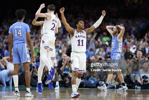 Remy Martin, Jalen Wilson and Christian Braun of the Kansas Jayhawks react in the second half of the game against the North Carolina Tar Heels during...