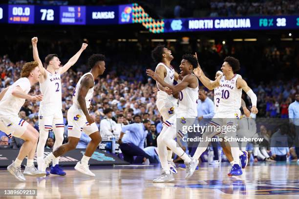 The Kansas Jayhawks celebrate after defeating the North Carolina Tar Heels during the second half of the 2022 NCAA Men's Basketball Tournament...