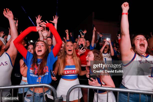 University of Kansas students react to watching the NCAA National Championship men's basketball game during a watch party in Lawrence, Kansas during...