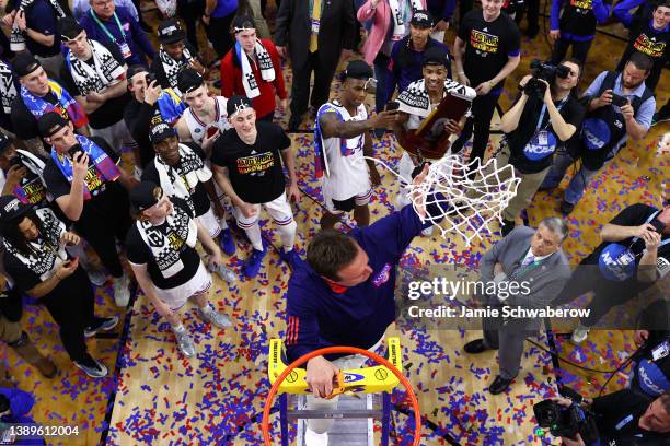 Head coach Bill Self of the Kansas Jayhawks cuts down the net after defeating the North Carolina Tar Heels during the second half of the 2022 NCAA...