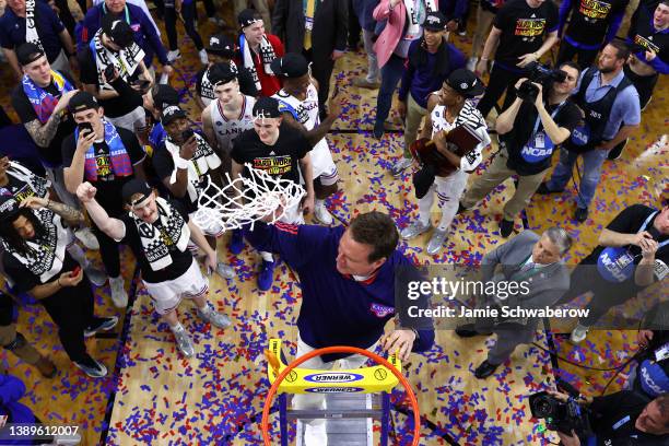 Head coach Bill Self of the Kansas Jayhawks cuts down the net after defeating the North Carolina Tar Heels during the second half of the 2022 NCAA...