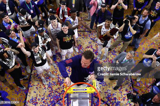 Head coach Bill Self of the Kansas Jayhawks cuts down the net after defeating the North Carolina Tar Heels during the second half of the 2022 NCAA...