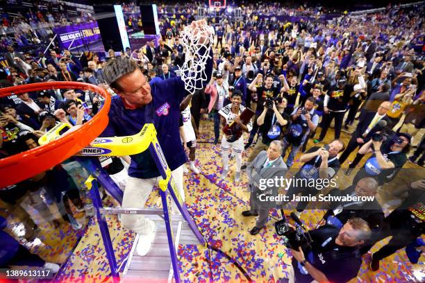 Head coach Bill Self of the Kansas Jayhawks cuts down the net after defeating the North Carolina Tar Heels during the second half of the 2022 NCAA...