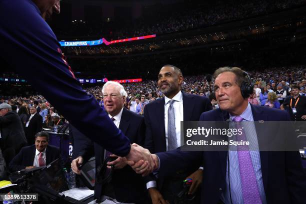 Head coach Bill Self of the Kansas Jayhawks shakes hands with CBS sports broadcaster Jim Nantz after defeating the North Carolina Tar Heels 72-69...