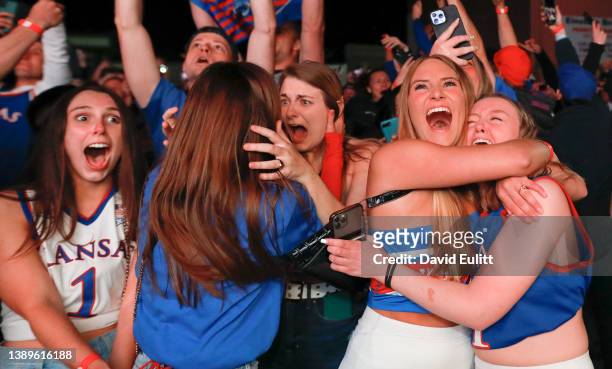 University of Kansas students react to watching the Kansas Jayhawks win the NCAA National Championship men's basketball game during a watch party in...