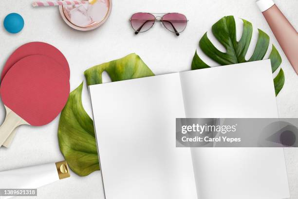 flat lay summer reading concept.magazine temp0late in summer background - white hat fashion item stockfoto's en -beelden