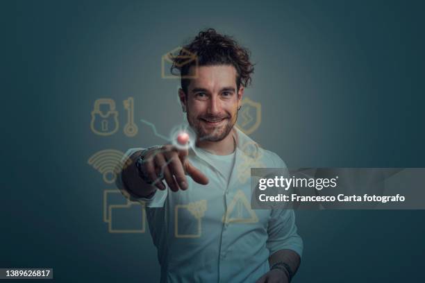 young man manages cyber security - data vulnerability stock pictures, royalty-free photos & images