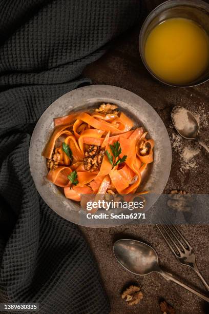 vegan carrot salad on a rustic bacground - carrot stock pictures, royalty-free photos & images