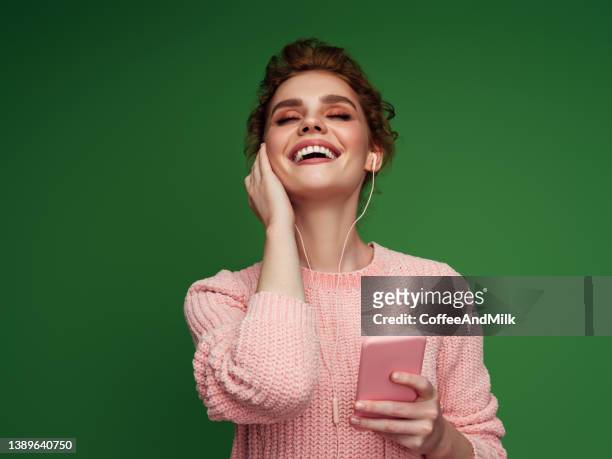 beautiful woman - headphones isolated stock pictures, royalty-free photos & images