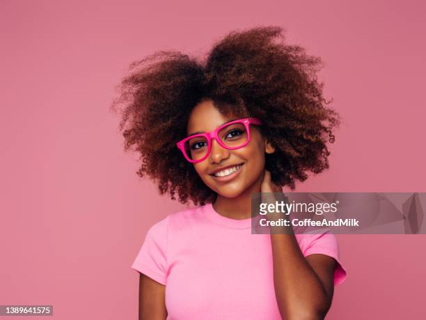 photo of young curly girl with glasses - choice student stockfoto's en -beelden