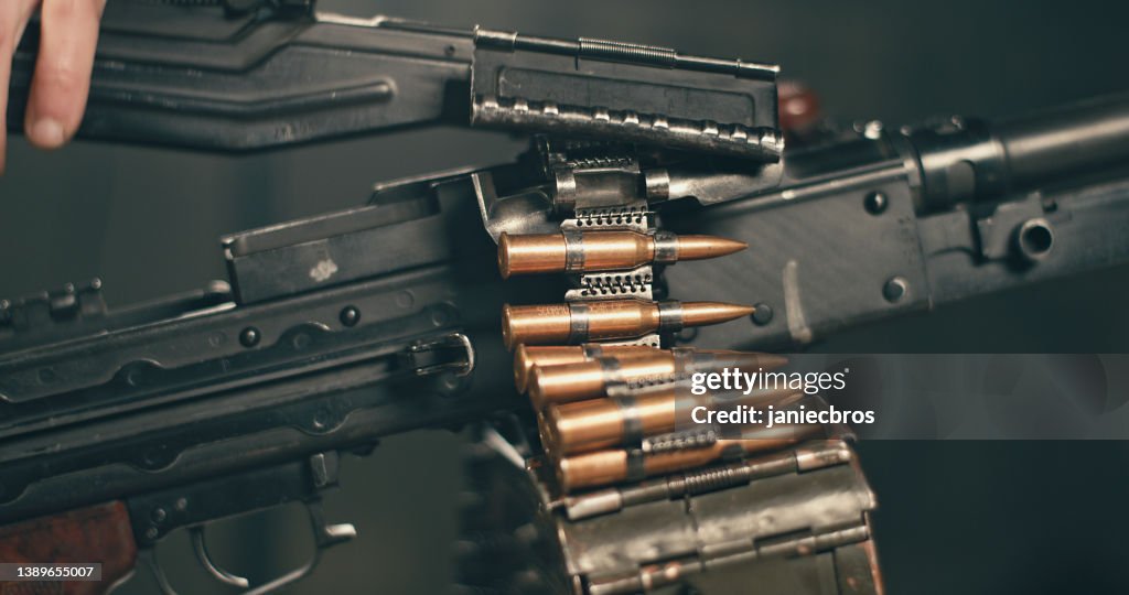 Professional Shooter Loading And Preparing To Use Heavy Pkm Machine Gun ...