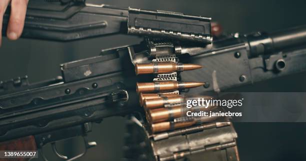 Man Holding Machine Gun Photos and Premium High Res Pictures - Getty Images