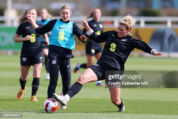 Millie Bright of England stretches for the ball ahead of Ellen White of England during a training session ahead of their Women's World Cup qualifier...