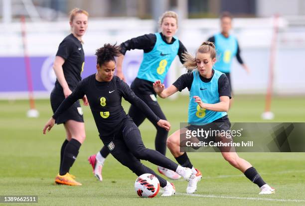 Demi Stokes of England and Ella Toone of England battle for the ball during a training session ahead of their Women's World Cup qualifier match...