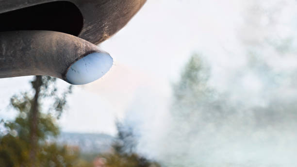 car pipe emitting smoke. - white smoke from exhaust cars stock pictures, royalty-free photos & images