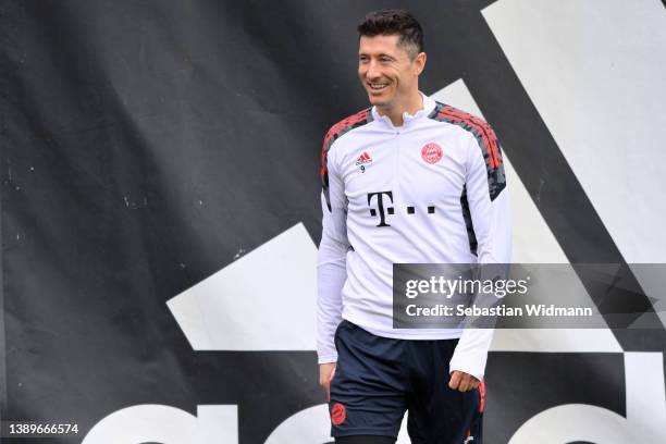 Robert Lewandowski of FC Bayern München smiles during a training session at Saebener Strasse training ground on April 05, 2022 in Munich, Germany. FC...