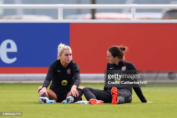 Alessia Russo of England and Lotte Wubben-Moy of England speak during a training session ahead of their Women's World Cup qualifier match against...