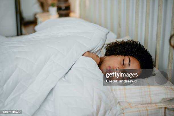 teenager sleeping in bed - teen sleeping bedroom stock pictures, royalty-free photos & images