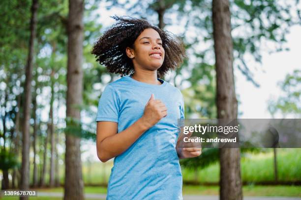 teenager exercising - 14 year old biracial girl curly hair stock pictures, royalty-free photos & images