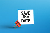 Save the date. Metal clip with note paper and save the date note