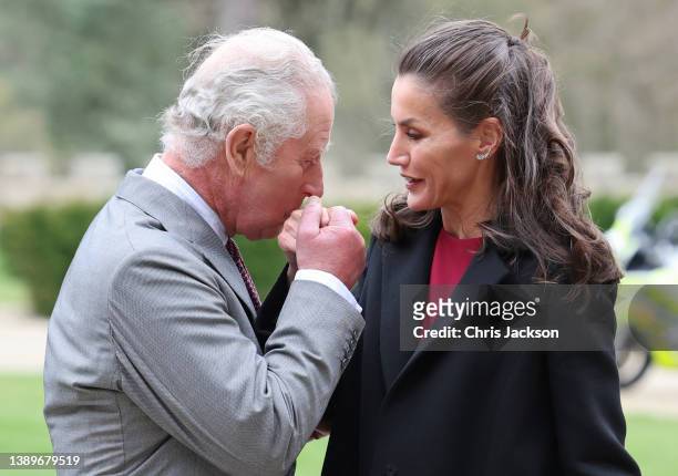 Prince Charles, Prince of Wales kisses the hand of Queen Letizia of Spain during their arrival at Auckland Castle on April 05, 2022 in Bishop...