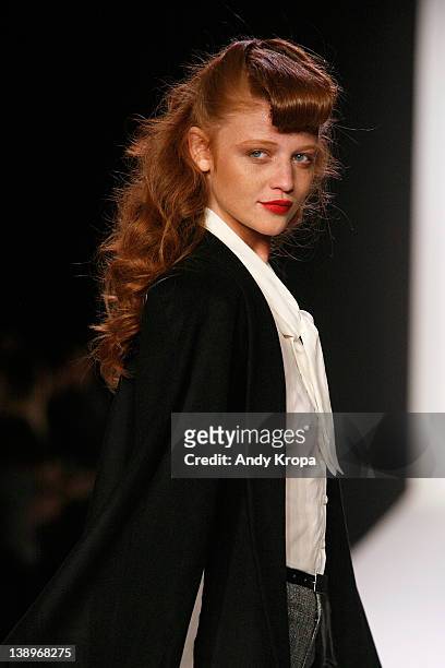 Fashion model Cintia Dicker walks the runway at the Bebe Black Collection fall 2012 fashion show during Style360 at Metropolitan Pavilion on February...