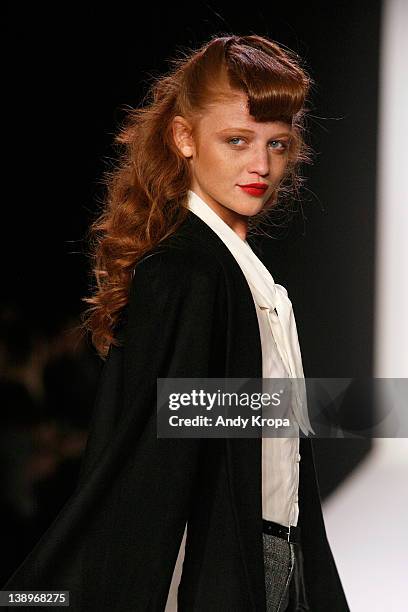 Fashion model Cintia Dicker walks the runway at the Bebe Black Collection fall 2012 fashion show during Style360 at Metropolitan Pavilion on February...