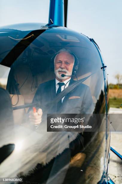 businessman using helicopter - helicopter cockpit stock pictures, royalty-free photos & images