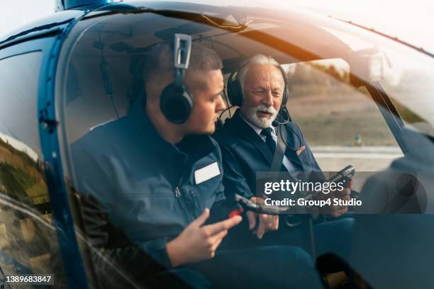 businessman using helicopter - helicopter pilot stock pictures, royalty-free photos & images