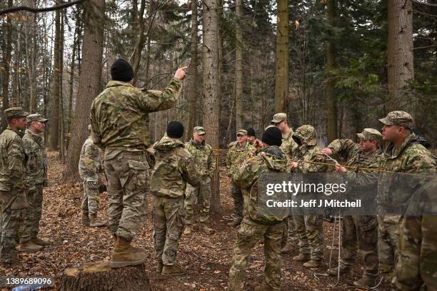 Soldiers from the 82nd Airborne take part in an exercise outside the operating base at the Arlamow Airport on April 05, 2022 in Wola Korzeniecka,...