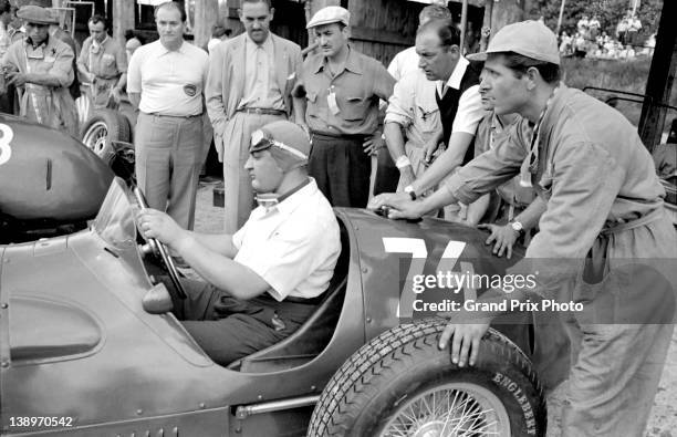 Jose Froilan Gonzalez of Argentina sits aboard the Scuderia Ferrari 375 Ferrari V12 in the pits during practice for the German Grand Prix on 28th...