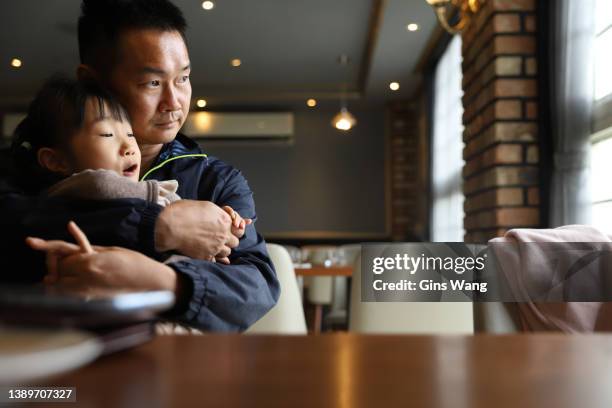 a asian family eating brunch in a restaurant. - fathers day lunch stock pictures, royalty-free photos & images