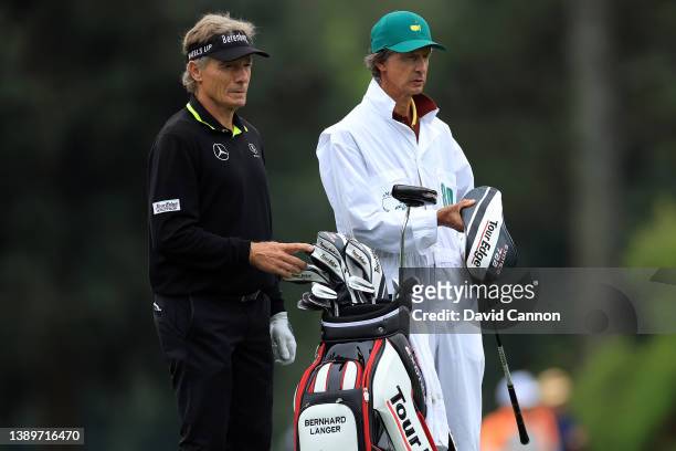 Bernhard Langer of Germany talks with his caddie Terry Holt on the 13th hole during a practice round prior to the Masters at Augusta National Golf...