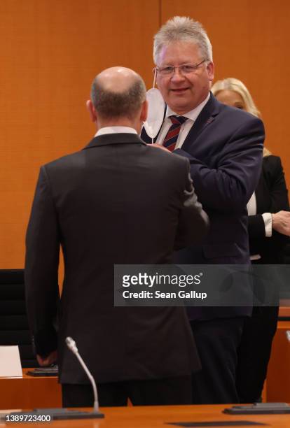 German Chancellor Olaf Scholz greets Bruno Kahl, head of Germany's foreign intelligence service, the BND , prior to a meeting of the federal security...