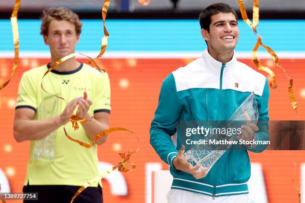 Carlos Alcaraz of Spain celebrates with the Butch Buchholz Trophy after defeating Casper Ruud of Norway during the men's final of the Miami Open at...