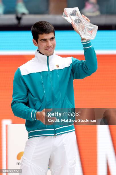Carlos Alcaraz of Spain celebrates with the Butch Buchholz Trophy after defeating Casper Ruud of Norway during the men's final of the Miami Open at...