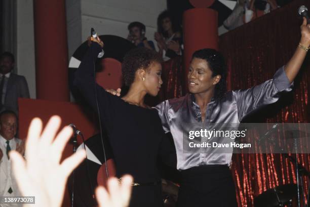 American singer Whitney Houston performs with Jermaine Jackson at The Limelight in New York City, 1st July 1984.