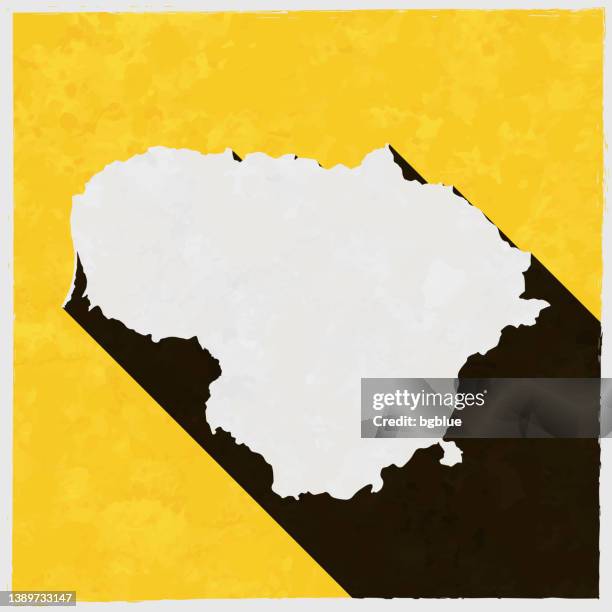 lithuania map with long shadow on textured yellow background - old vilnius lithuania stock illustrations