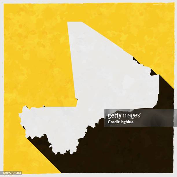 テクスチャ付きの黄色の背景に長い影を持つマリの地図 - bamako点のイラスト素材／クリップアート素材／マンガ素材／アイコン素材