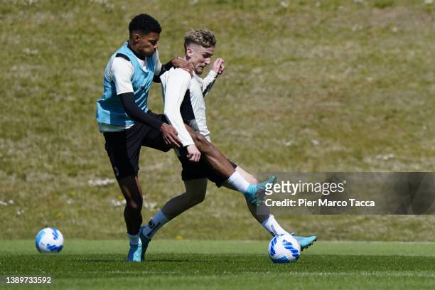 Emil Roback and Alexis Saelemaekers in action during an AC Milan training session at Milanello on April 05, 2022 in Cairate, Italy.