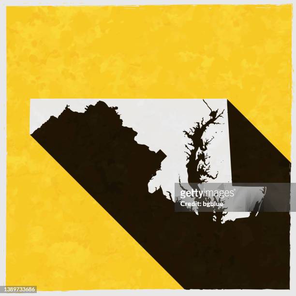 maryland-karte mit langem schatten auf strukturiertem gelbem hintergrund - maryland staat stock-grafiken, -clipart, -cartoons und -symbole