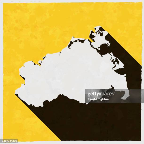 mecklenburg-vorpommern map with long shadow on textured yellow background - fancy frame border stock illustrations
