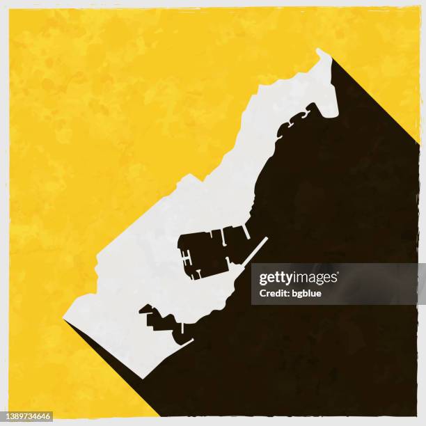 monaco map with long shadow on textured yellow background - monaco stock illustrations