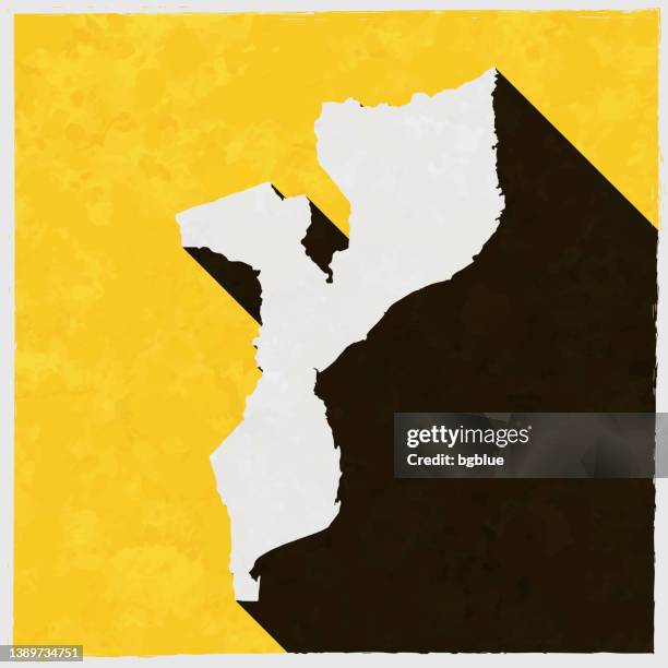 mozambique map with long shadow on textured yellow background - maputo mozambique stock illustrations