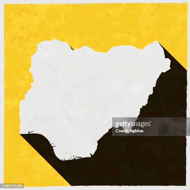 nigeria map with long shadow on textured yellow background - 拉各斯 幅插畫檔、美工圖案、卡通及圖標